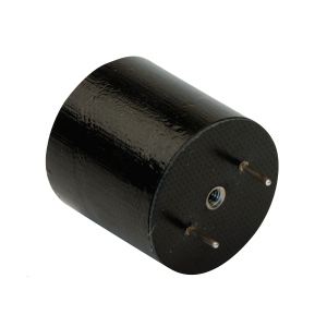 A black cylindrical electronic component with two metal pins and a central hole on one flat end, often used in power magnetics applications, shown against a white background. by Standex Edge
