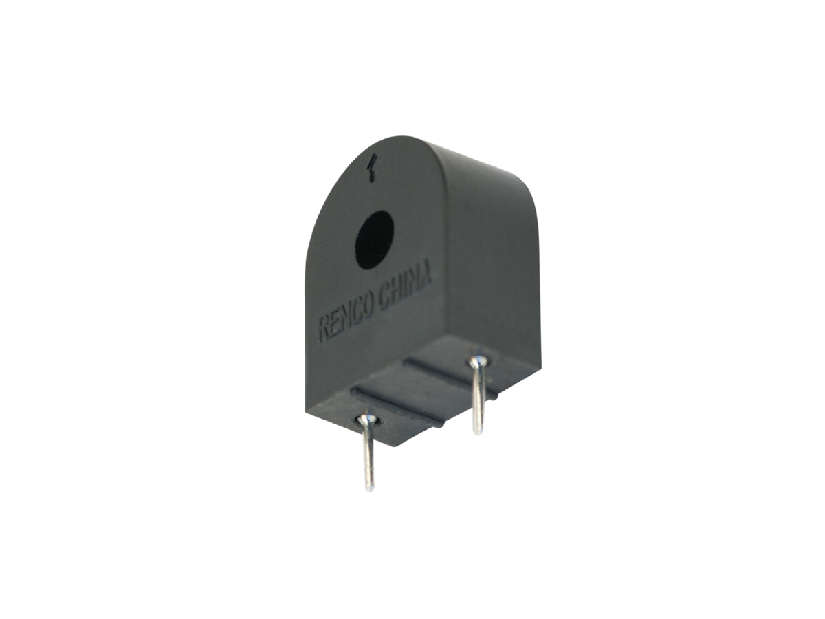 A black, rectangular electronic component with a rounded top, labeled RENCO CHINA, featuring a circular hole and two metal pins at the bottom for circuit board mounting. This power magnetics device is photographed against a white background. by Standex Edge