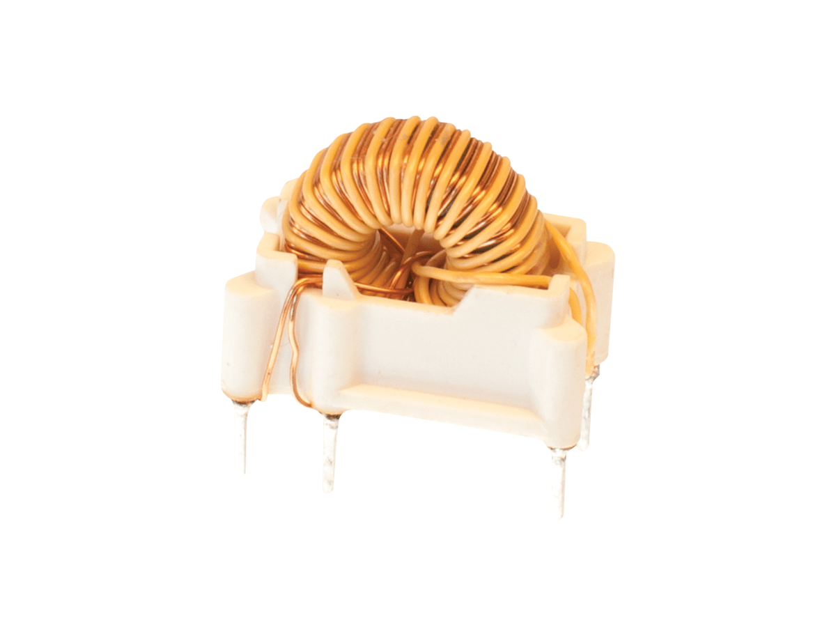 A high frequency transformer with copper wire coils is mounted on a white plastic base with four metal pins extending downward, isolated on a white background. by Standex Edge