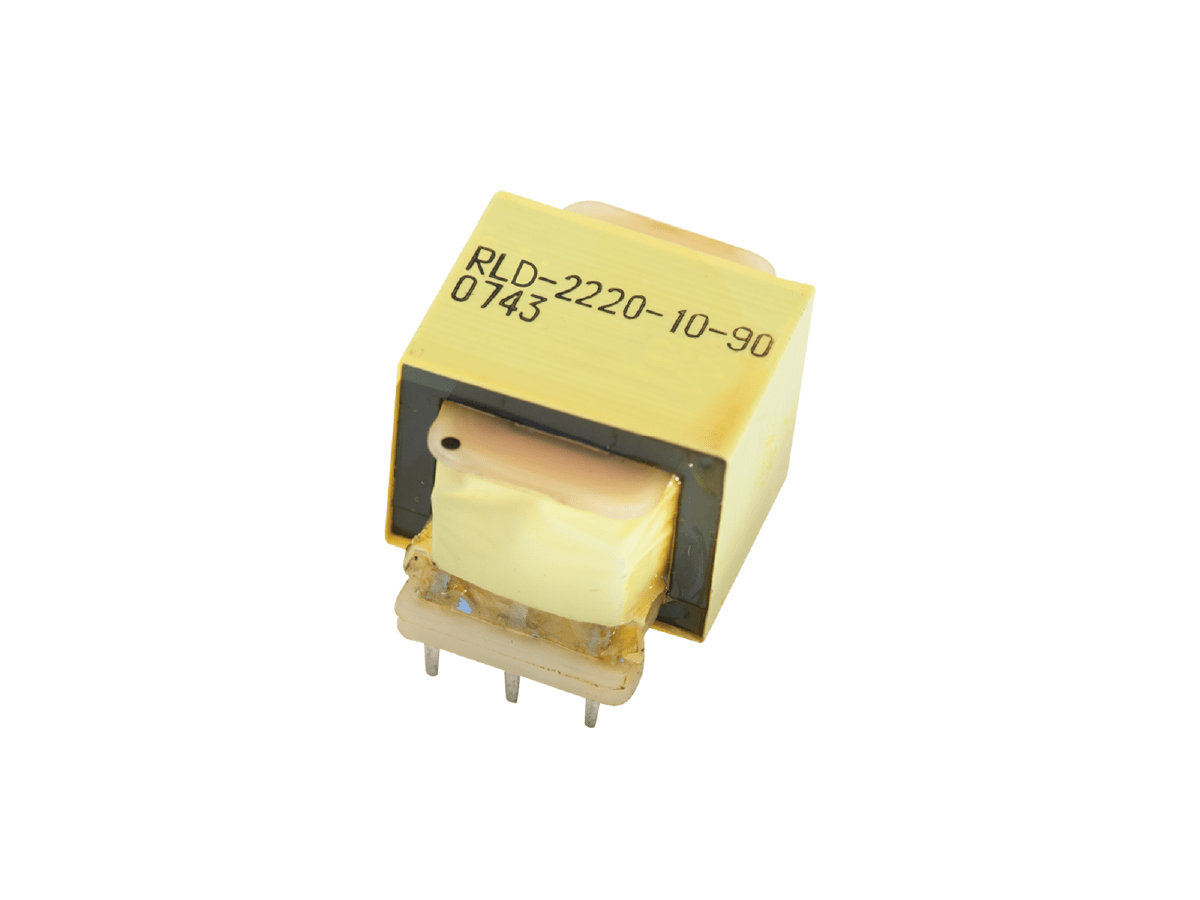 A small, yellow, rectangular Standex Edge power inductor with four metal pins and the code “RLD-2220-10-90 0743” printed on top, isolated on a white background. by Standex Edge