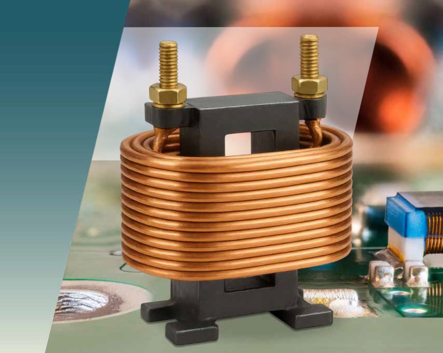 A close-up of a copper wire coil wound around a black core with two bolts on top, mounted on a circuit board, highlights the clearance and creepage distances between components amid blurred electronic parts in the background. by Standex Edge